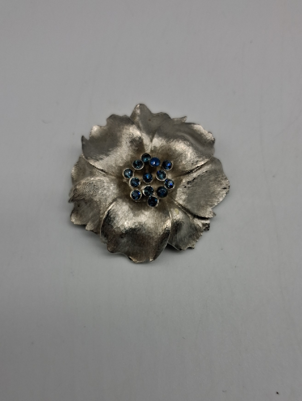 Silver Flower Brooch with Blue Rhinestones